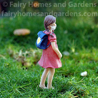 Miniature Girl Figurine with Mask and Backpack 