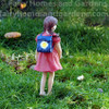 Miniature Girl Figurine with Backpack and Mask - Back View