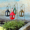 Miniature garden lanterns on a wire hook.