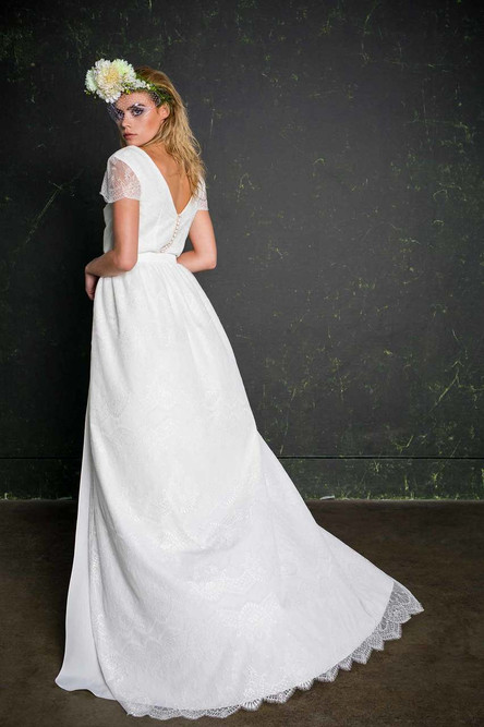 The Chung provides the perfect transformation between ceremony and party, bride and boogie. Simply whip off your skirt (if you so desire!) whenever you’re ready and use it as a cape on the dance floor! Finished with a pretty scalloped edge, this half-skirt adds a touch more glamour to the Lowry bridal jumpsuit.


