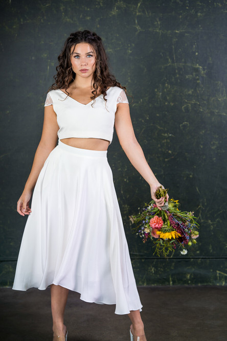 This classic beauty of a bridal skirt is a simple, modern and fun alternative to the wedding dress. The Thomas has a waterfall design so that the back slightly dips when compared to the front. Made with 100% silk over a heavy lining to give a fabulous shape and an incredible spin! The Thomas skirt features here with the Thomas top. 