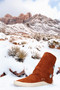 San Agustin Trading Co. 2 Button moccasin photographed on snow filled Southern California mountain side.