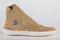 Side view of our one-button style moccasin in our sand color leather