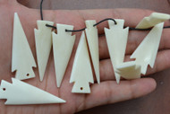 Small Carved Buffalo Bone Arrowhead Pendants