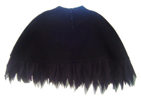 Sunset -  Waist, even length cape made of pure new wool jacquard in a espaliered motif, with silk "feathers on the hem.